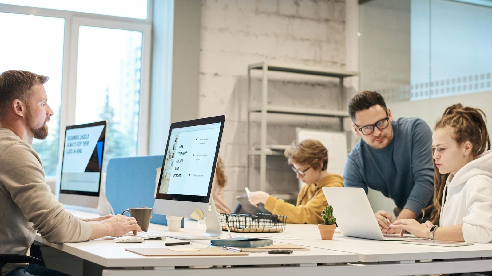 Photo Of People Near Computers